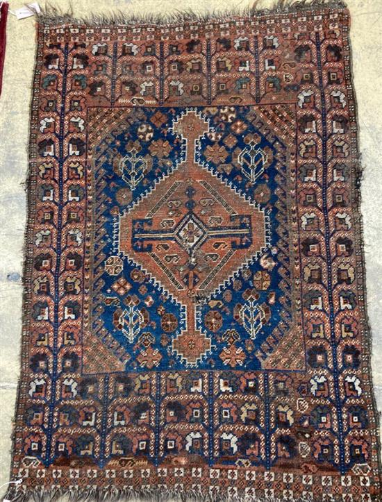 A Caucasian blue ground rug, 128 x 89cm, a Persian style red ground mat and a gold ground rug